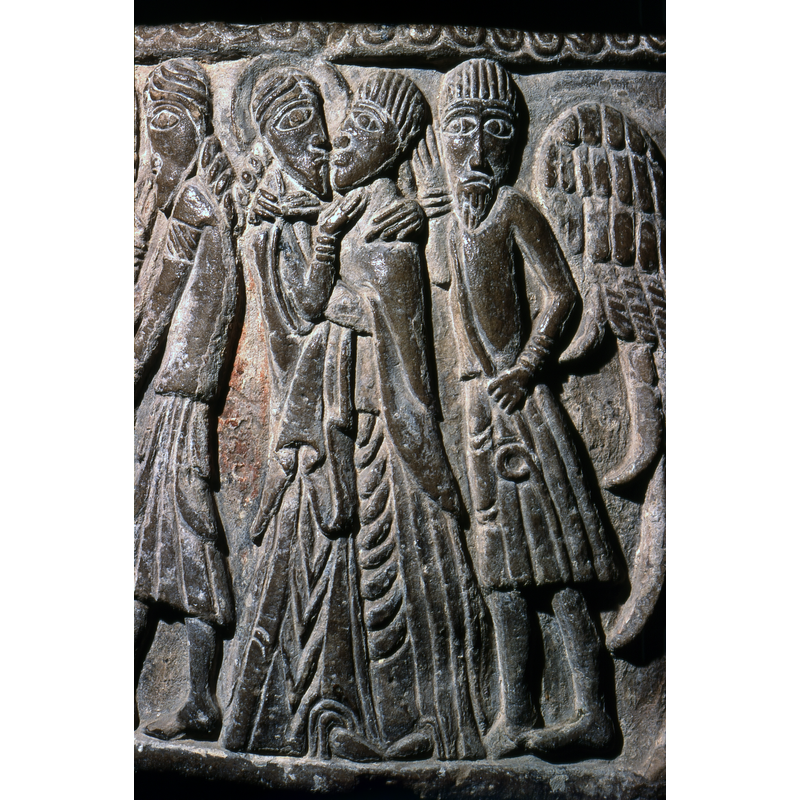 Kiss of Judas: three figures comprise this scene; Christ stands on the left, Judas on the right kissing him in the mouth; the two embracing each other; the third figure is holding a rope and has his right hand near his face - is he pointing out to the viewer the doomed fate of the kiss?