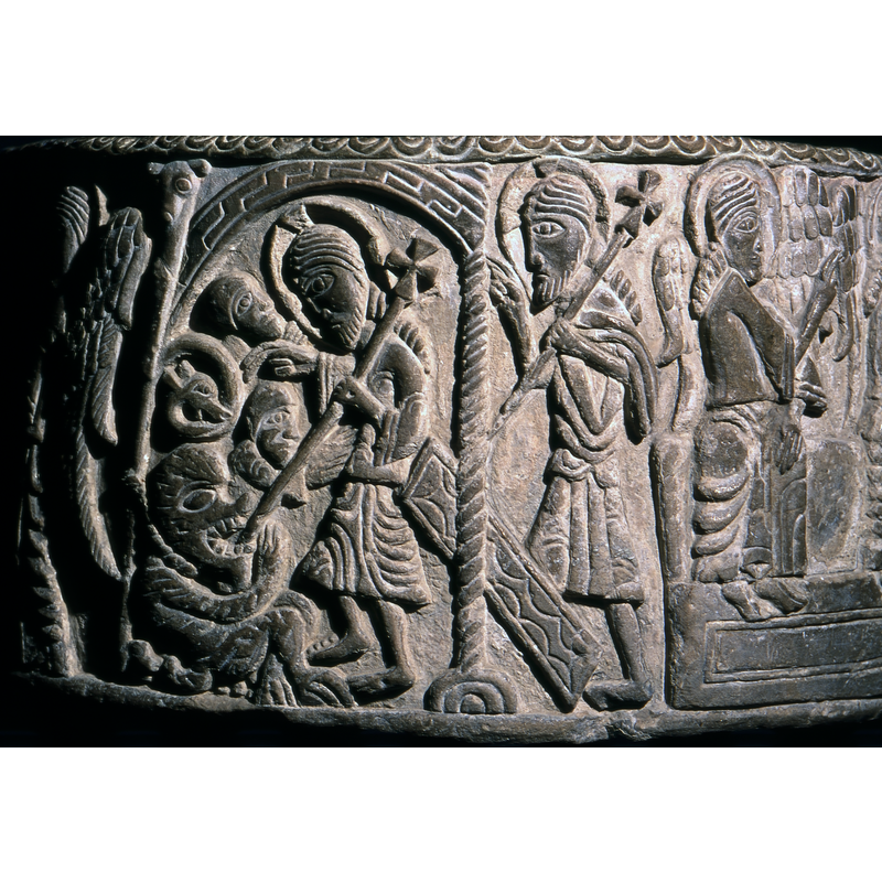 Harrowing of Hell: in a fret-patterned arch on two columns, the one on the right with torsade pattern, the other plain but topped by an animal head; Christ carrying the processional cross as in the Resurrection scene, here poking inside the devil in his mouth, Christ walks to the left; at the bottom left of the scene is a large demon seated and tethered to the column by a thick rope; near the demon's head a coiled beast, perhaps the demon's tail; above the devil are two human heads with Christ's right hand between them; the lower one has a shoulder and an arm that touches Christ's body
