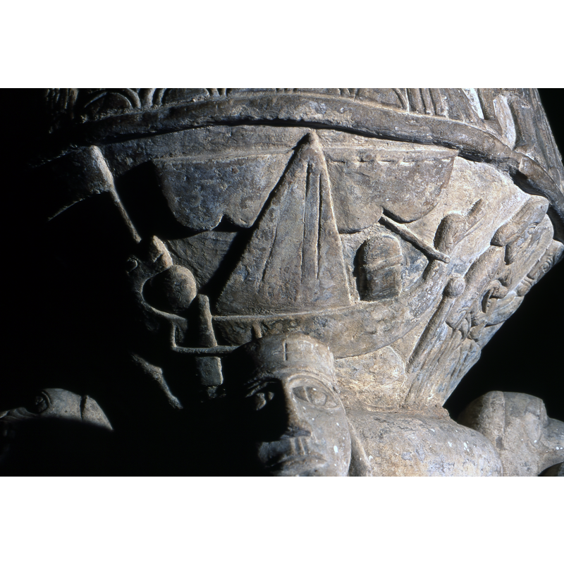sailing [Viking?] ship with heads at prow and bow, a large flag on the bow end