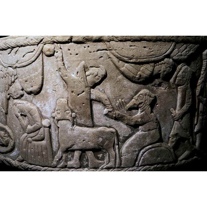 Joseph's Dream seen here in the bottom left corner of the image. Joseph is seated in a Gotland chair, holding his forehead with his right hand, elbow on his knee; and above him an angel descends from the cloud, the left wing folded back and right one extended and touching Mary's bed.