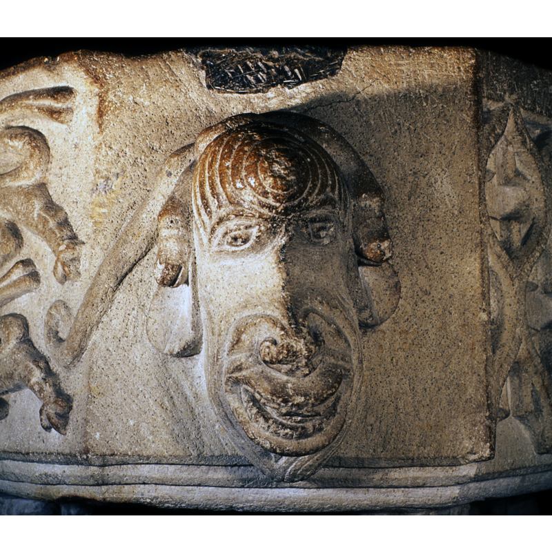 the two heads of the serpent at the head's ears; on the northwest side of the basin