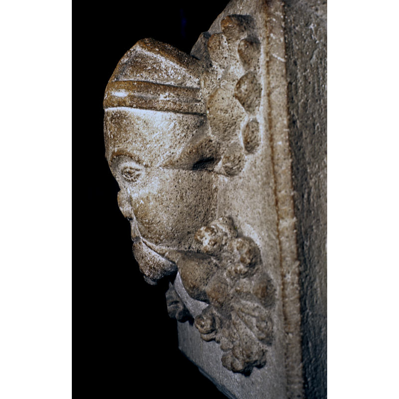 same head, in profile; on the southeast side of the basin