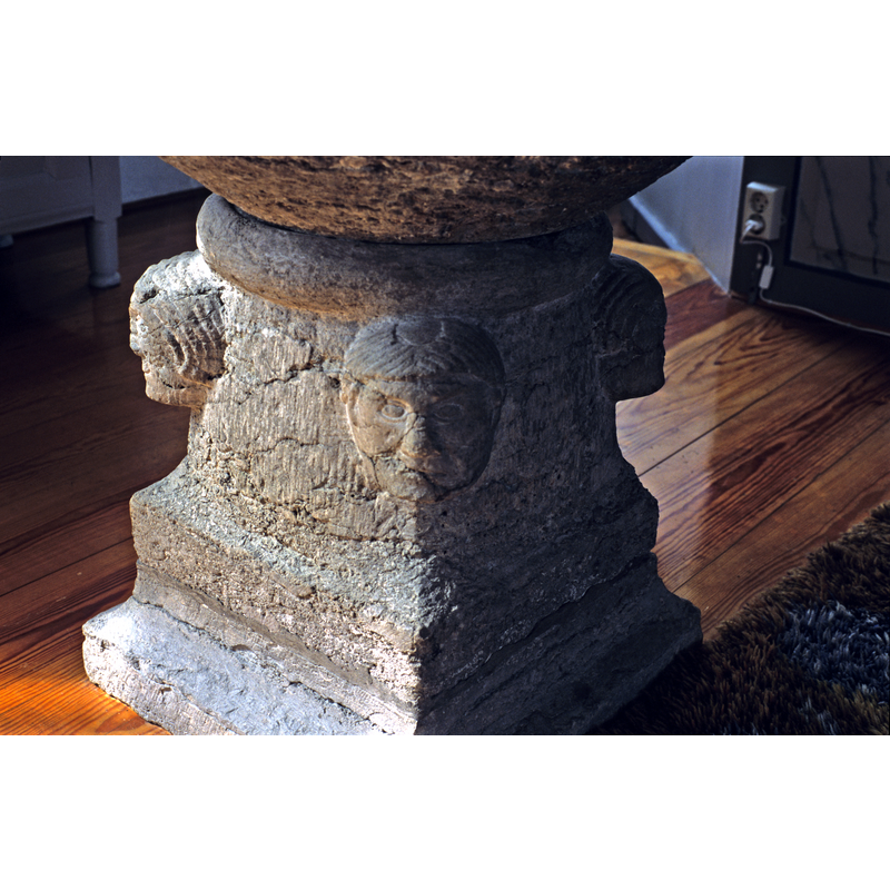 showing three of the four heads; the one in the middle is tonsured