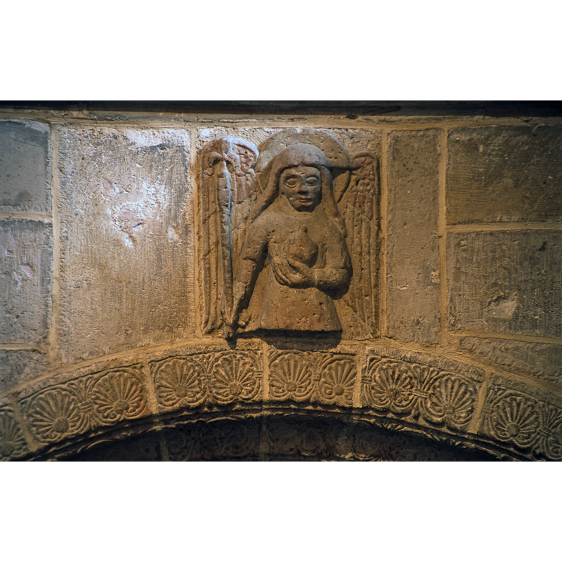 angel above the descent to the crypt