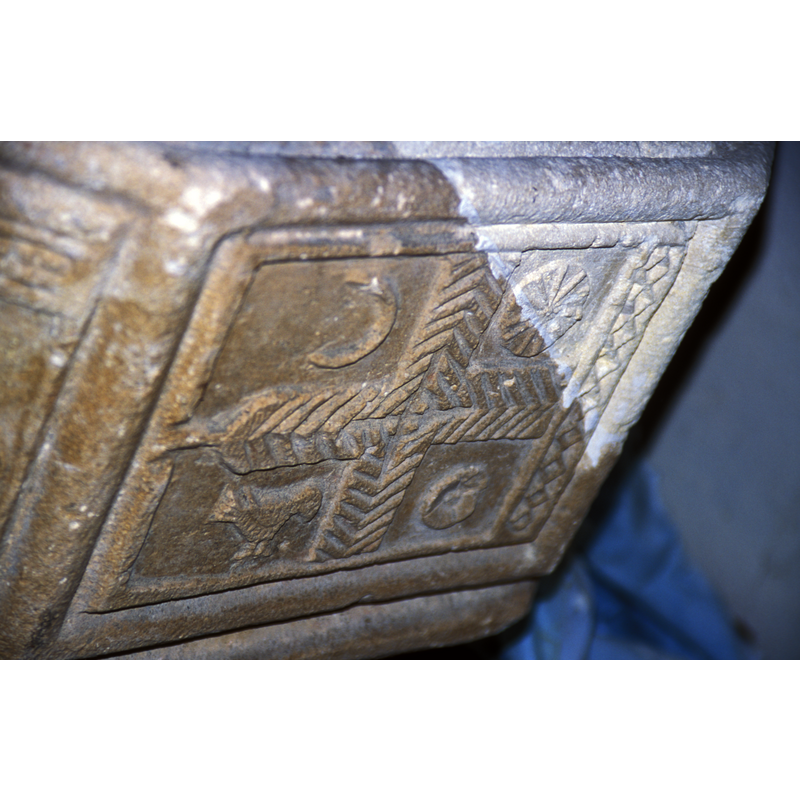 the arms of the cross are made of chevron motif; the other motifs fill the four spaces between the arms of the cross