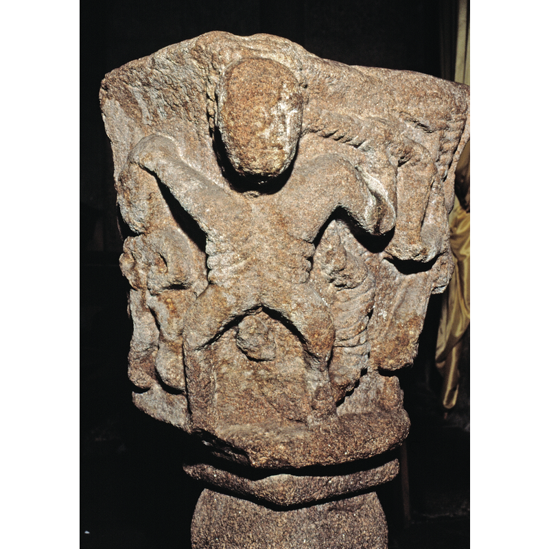 he has his left and on the thick rope that, looped around his head, is being pulled by the angel that is partially visibleon the right side of the image