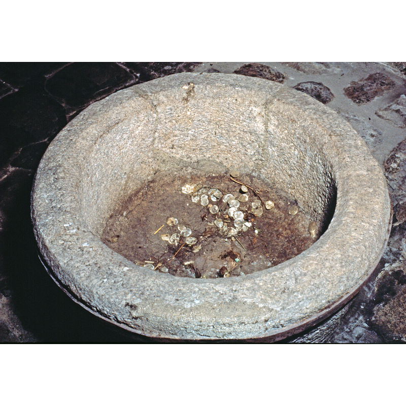 the drain hole, partially visible here, is blocked now -- the crcked lines where the repairs were made are discernible on the back side -- was it ever used as a font?