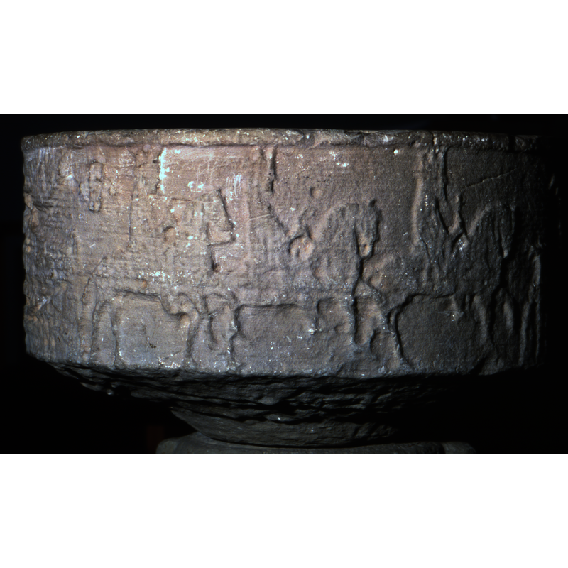 the three crowned Magi in profile, riding richly adorned horses, ride towards the right; a cross divides this scene from the previous one