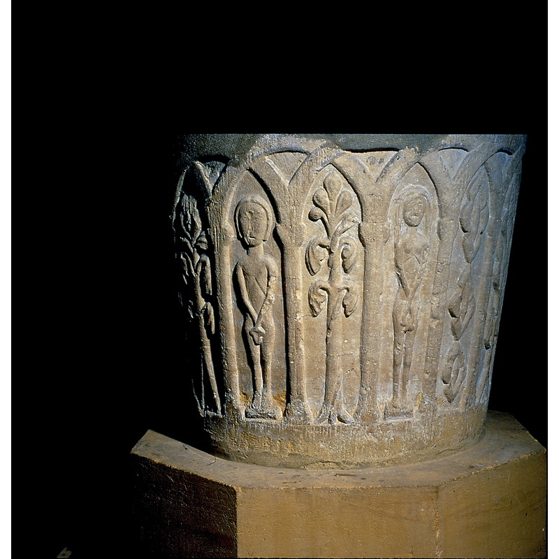 They hold fig leaves over their genitals. Each carved in their own niche