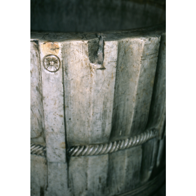 all around the vat-like basin -- notice the damage to the rim side, probably related to an old cover anchorings