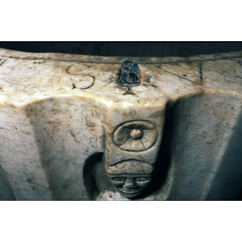 Several of them on the side of the basin; one over and another under the figure as well -- notice the lead plug in the upper rim, just above the figure; there is another at the opposite end (?) of the rim, evidence of anchorings for an old cover