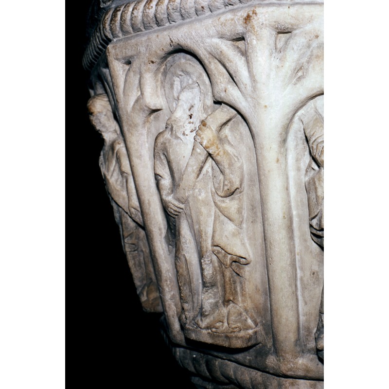 haloed and holding a scroll; defaced