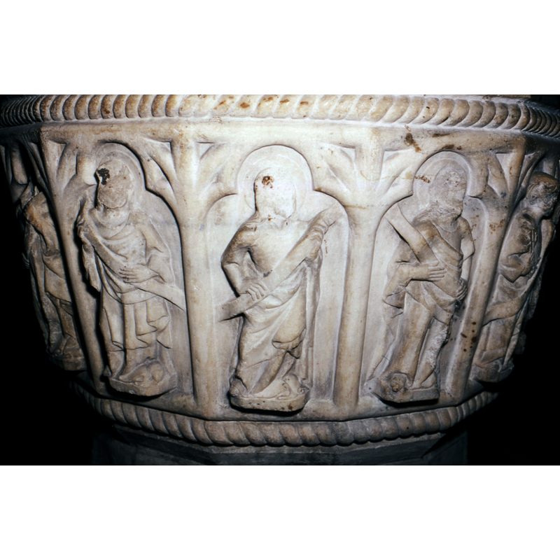haloed and holding scrolls; all three defaced