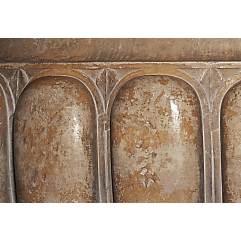 stylised motifs incised in the spandrels, between the thick ribs of the basin sides