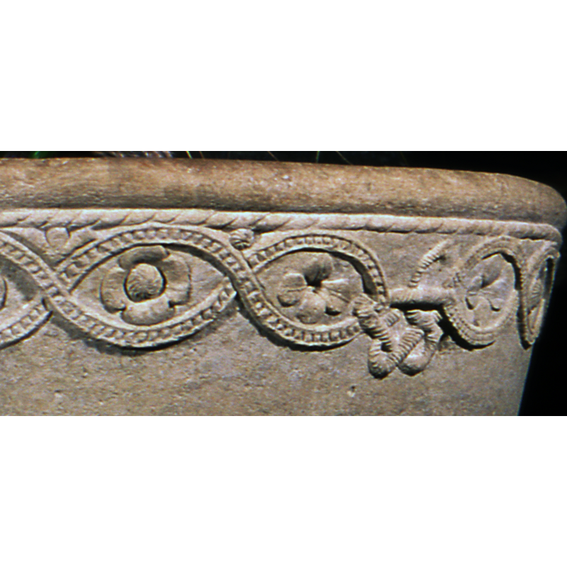 it is quite possible the artisan miscalculated the spacing of the interlace loops but he showed his mastery in the tie-link knot with which the gap is filled