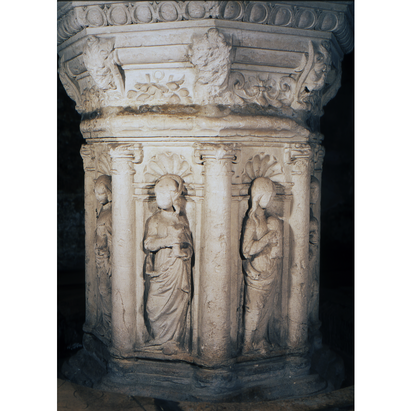 Female figure appears to be holding a chalice