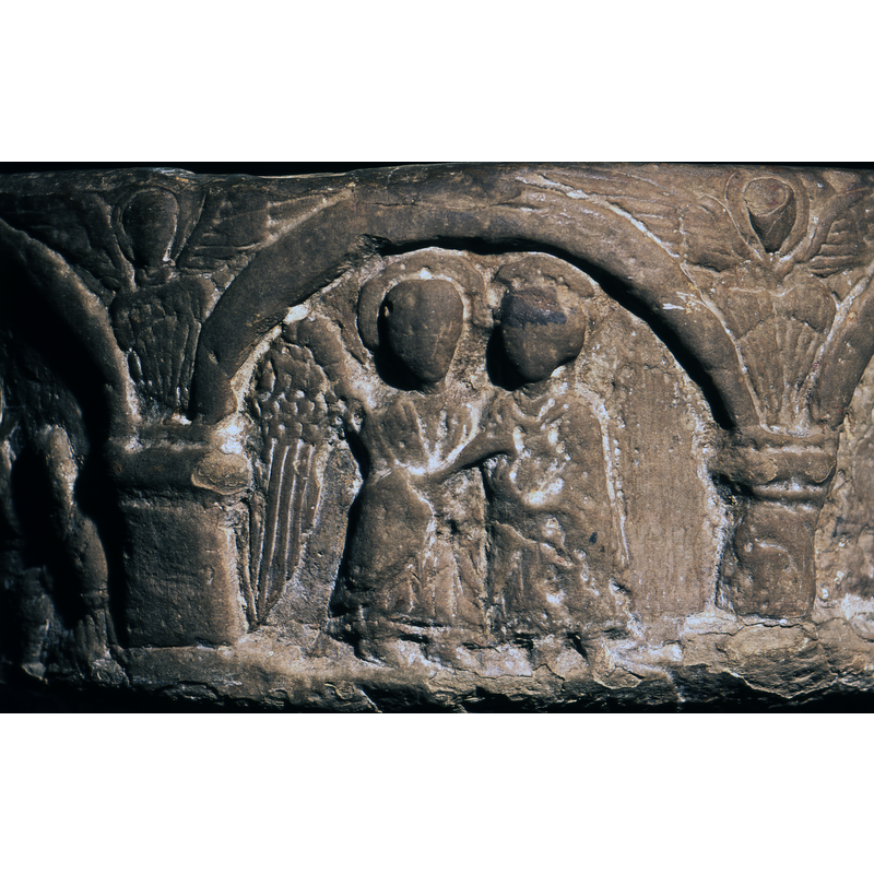 Two figures, full frontal, both haloed; Gabriel, on the left, extends his hand to Mary; Mary's hands held to her chest in prayer