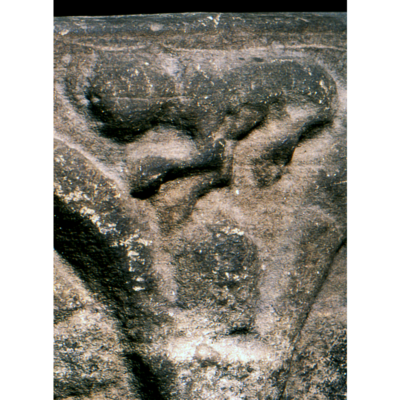 the elements that decorate the spandrels of the arcade are badly damaged and eroded, but some outlines are still discernible enough to make out their identities: this one a lion (?) passant