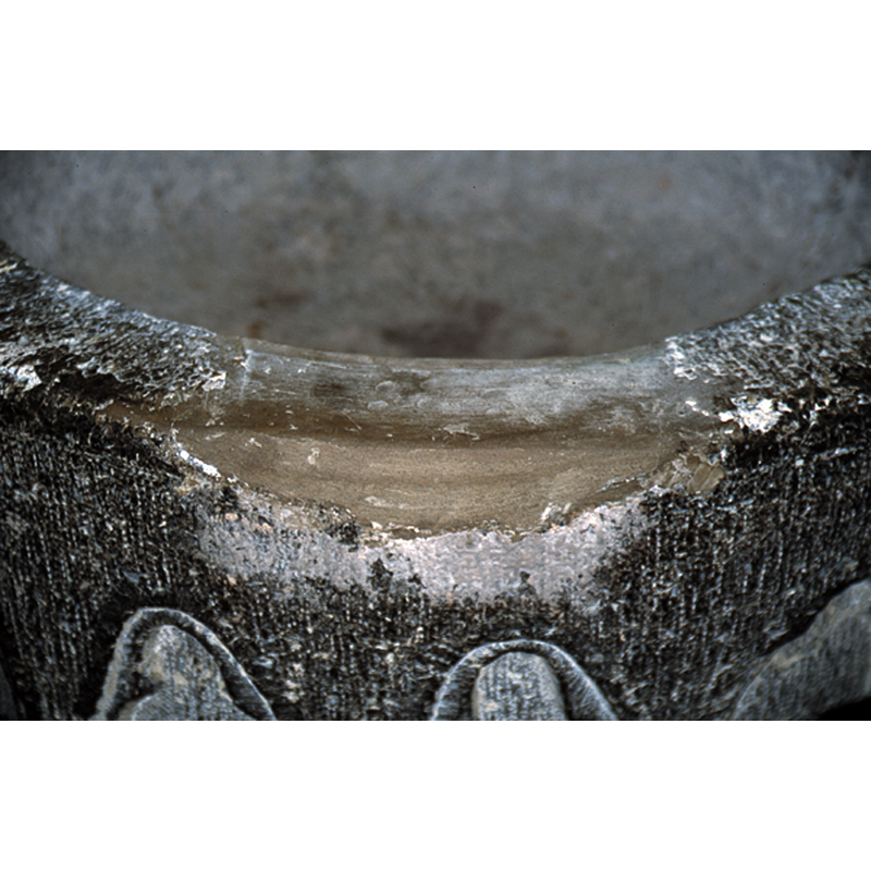 a repair to damage probably caused by a metal staple in the upper rim