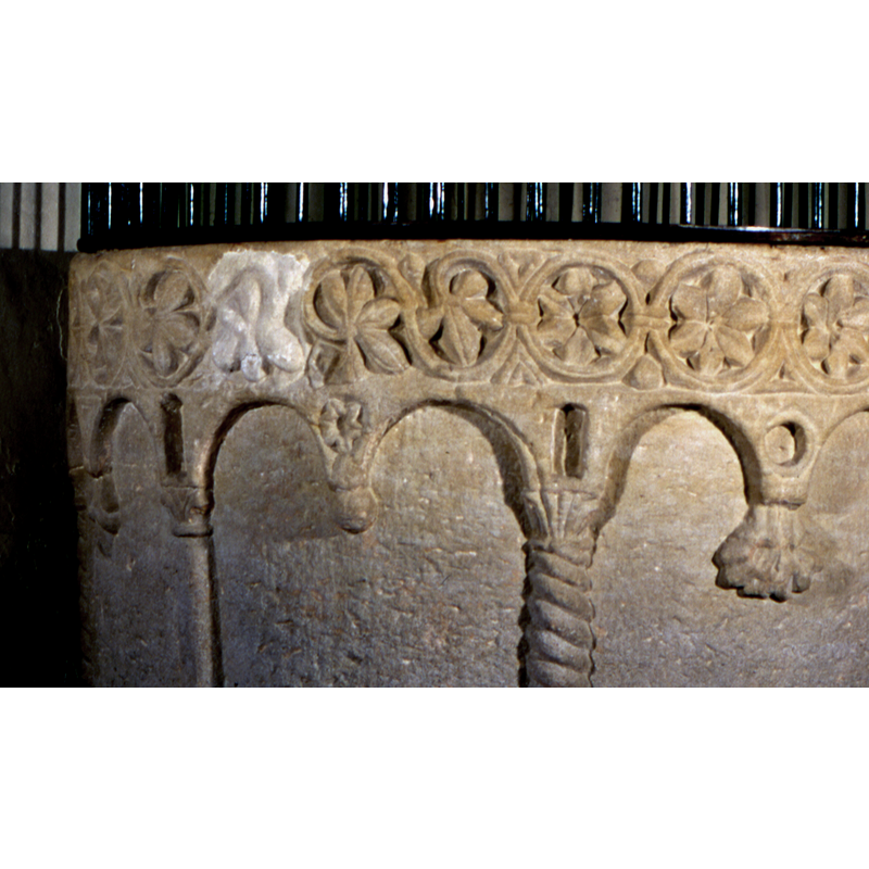 seen here on the left side, whereas the right side is decorated with inscribed rosettes -- there are geometric motifs in the tiny spandrels