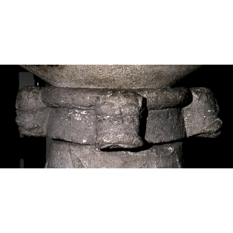 these three, if not all, are animal heads; at 90-degree angles on the upper base