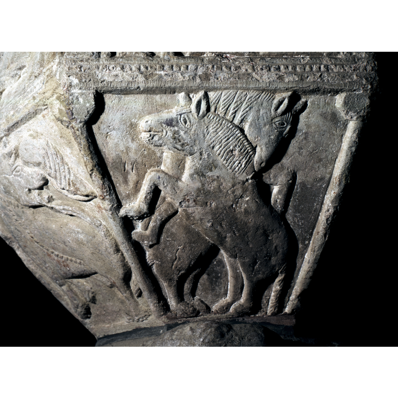 One of 8 motifs on the underside - under the Nativity - two horses, appear to be fighting - one bites the neck of the other.