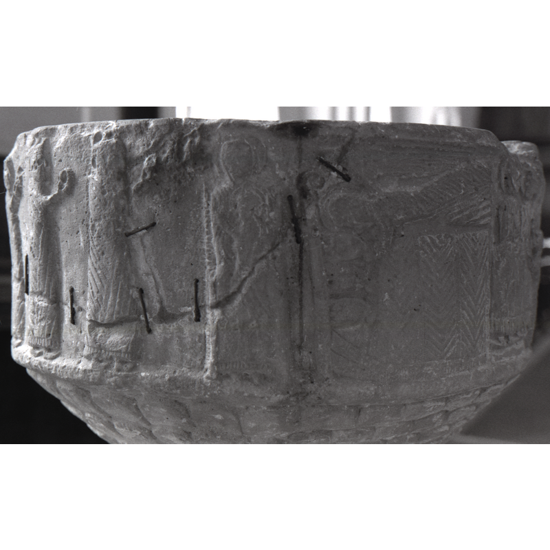 at the centre of the image are the Madonna and Child, part of the Adoration of the Magi scene, with the Magi walking rightwards from the left end; the right side shows the Dream of the Magi scene -- the damage and repairs to the basin are discernible here