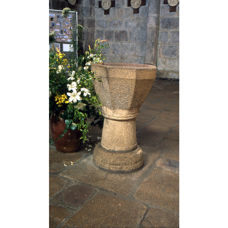 located at the west end of the nave, centre aisle