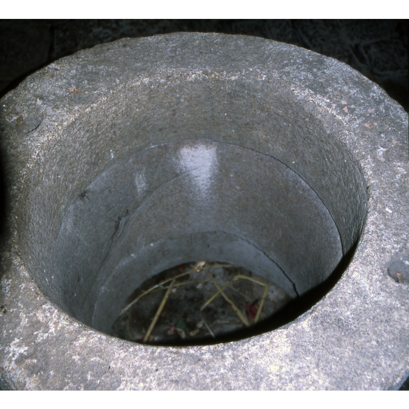 upper view of the old well-head inside the church now, at the west end, south side