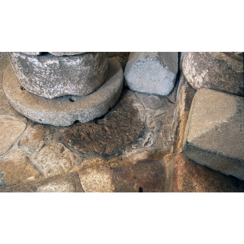 The plinth (?) of the ancient font remains in place inside the church, at the west end, south side -- the object that stands covering part of it is an old well-head from the abbey.