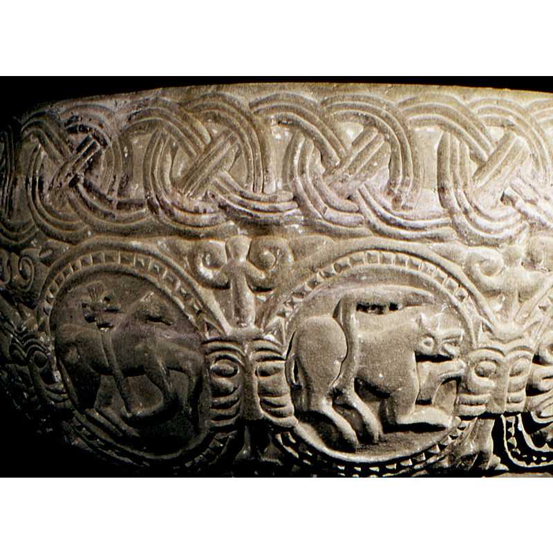 at each place where the beaded-tape circles meet they are linked by a beautiful lion head of the Norman/Scandinavian type -- 3 of them visible here