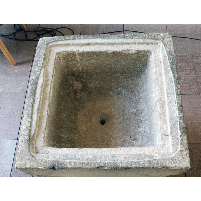 showing the trim of the upper rim for a font cover, and the drain hole