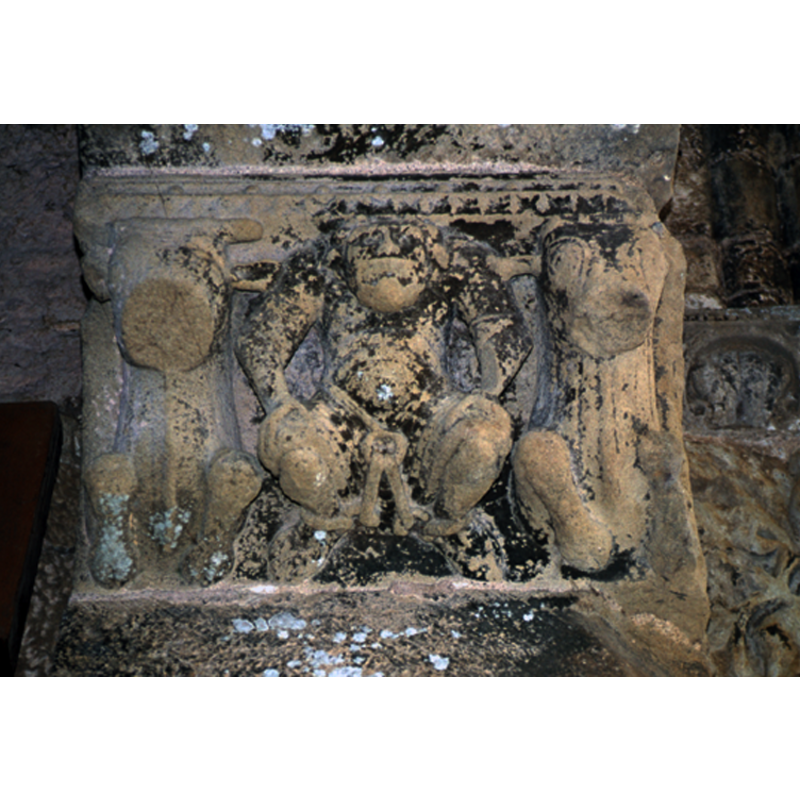 the abutment or imposte on the south side includes three seated 'creatures': the two on the sides appear to be seated lions; the one in the centre appears rather simian, with hunched shoulders and hands resting on its knees; the legs are manacled to a chain that girds its waist. Sin? Devil?