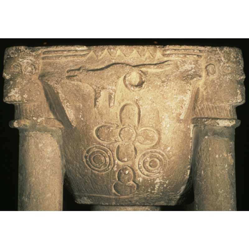 on the west side: the dragon, facing left and with characteristic looped tail, has been crudely executed