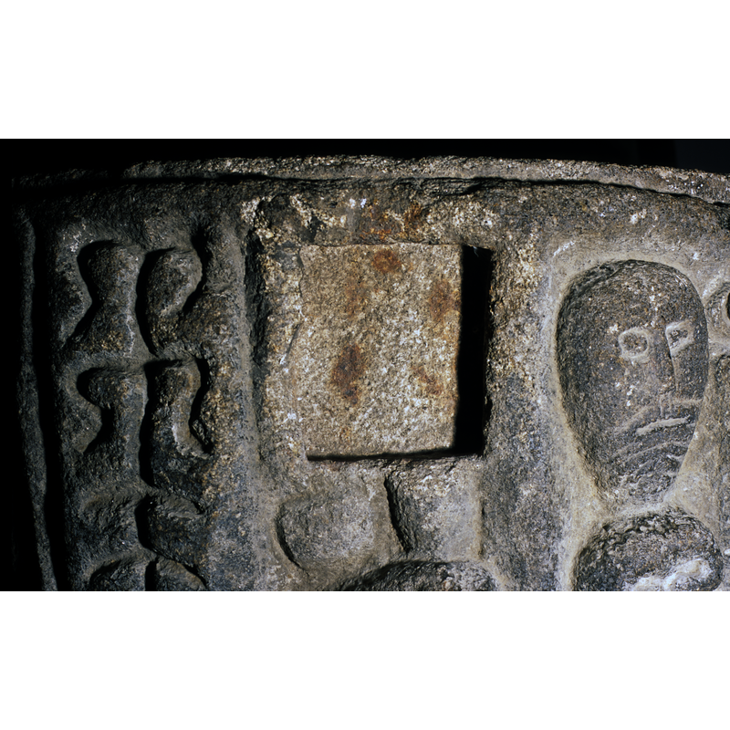 one of the two receded squares suited for the cover lock [cf. Font notes]