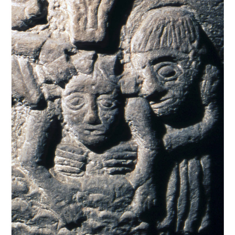 the tonsured monk holds Christ by the chest in the waters of the Jordan