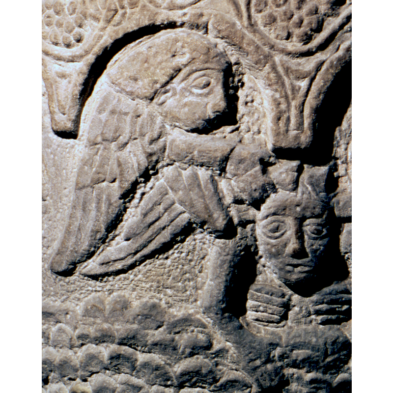 it is the angel on the left that pours water over Christ's head; the hands visible on Christ's chest belong to the monk who assists on the right