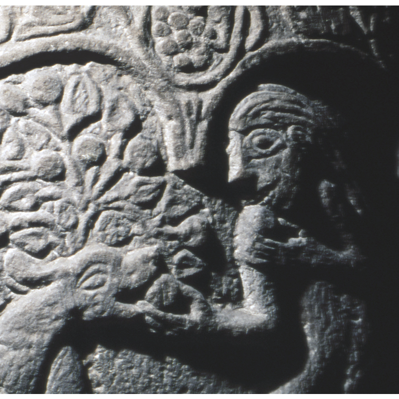 Eve's right hand receives the fruit from the serpent's mouth; her left hand raises the fruit to her mouth