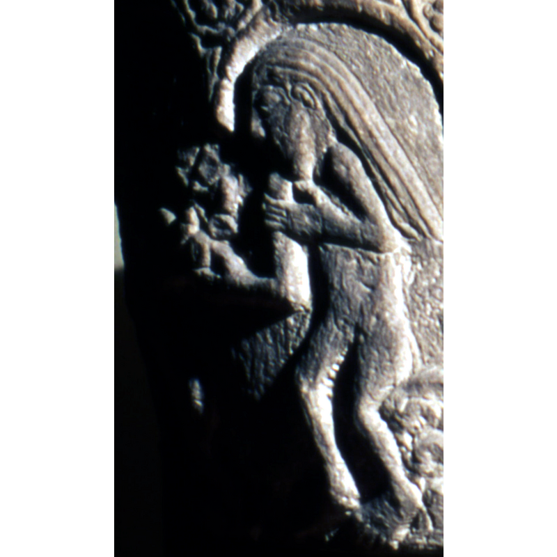 Eve, naked, received the fruit from the serpent
