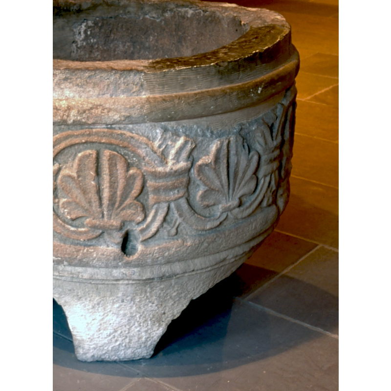 the upper right area of the basin is a reconstruction, showing the moulding as it probably was originally -- notice also the large hole drilled above the foot; such holes tend to indicate that the objects was used as planter in a garden after being disused from the church